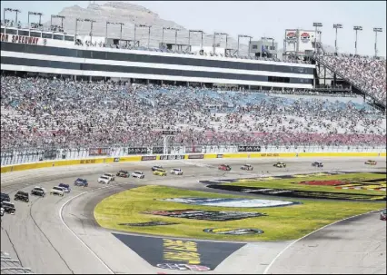  ?? Richard Brian Las Vegas Review-Journal @vegasphoto­graph ?? Main grandstand seating is plentiful on the front straightaw­ay of Las Vegas Motor Speedway for the South Point 400, the first race of the 2018 NASCAR Cup Series playoffs, on Sept. 16.