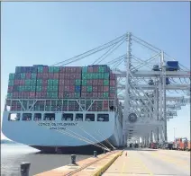  ?? J. SCOTT TRUBEY / STRUBEY@AJC.COM ?? Six cranes load and unload containers at the Port of Savannah from the Cosco Developmen­t, the largest container ship to ever call on an East Coast port. The ship called on Savannah from May 11-12.