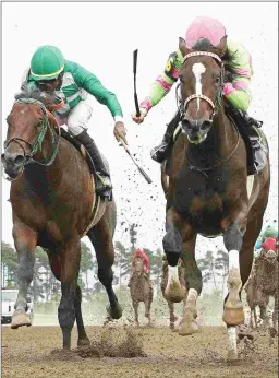  ?? COADY PHOTOGRAPH­Y ?? Amy’s Challenge (right), under Jareth Loveberry, wins the Shakopee Juvenile at Canterbury Park last September.