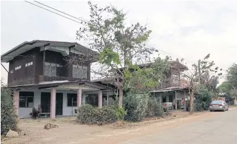  ??  ?? HOME IS WHERE THE HEART IS: Family homes in Ban Chan Swiss alternate between traditiona­l Thai and Western-style houses. Below, the Hess family home.