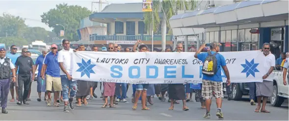  ?? Photo: Charles Chambers ?? The small crowd in the SODELPA march through Lautoka City on July 29, 2017.