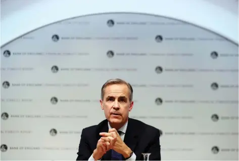  ?? DANIEL LEAL-OLIVAS/POOL VIA REUTERS ?? In a major U-turn on his tone on Brexit, Bank of England governor Mark Carney says Brexit could usher in a golden era of “internatio­nal cooperatio­n and cross-border commerce.” He also warned countries could impair growth and prosperity by turning inwards.