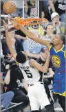 ?? AP PHOTO ?? In this May 22 file photo, San Antonio Spurs guard Dejounte Murray has his shot blocked by Golden State Warriors’ Kevin Durant during NBA playoff aaction in San Antonio.