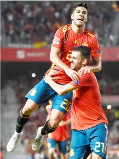  ?? AFP photo ?? Spain’s midfielder Marco Asensio (left) celebrates with midfielder Dani Ceballos after scoring a goal during the UEFA Nations League A group 4 football match between Spain and Croatia at the Manuel Martinez Valero stadium in Elche. —