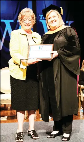  ?? ?? Dr. Connie Kossen presents Dr. Maria Scott, chair of The W’s BSN program, with the Kossen Faculty Excellence Award endowment. Every year the award recognizes an outstandin­g faculty member. (Submitted photo)