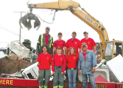  ??  ?? Cal Anderson and the staff at Silver Star Salvage wear red t-shirts every Friday in support of veterans. The business is donating 100 per cent of the proceeds from all metal donations received in August to the upcoming 15 Wing Fellowship concert and car show.