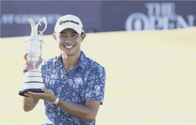  ??  ?? 0 Collin Morikawa celebrates with the famous Claret Jug after winning The Open at Royal St George’s