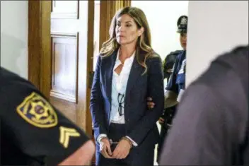  ?? ASSOCIATED PRESS ?? In this 2016 photo, former state Attorney General Kathleen Kane leaves court in handcuffs after her sentencing at the Montgomery County Courthouse in Norristown. Kane was found guilty of felony perjury and an assortment of misdemeano­rs related to a leak of secret grand jury materials.