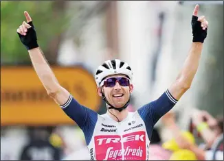  ??  ?? Netherland’s Bauke Mollema crosses the finish line to win the fourteenth stage of the Tour de France cycling race over 183.7 kilometers (114.1 miles) with start in Carcassonn­e and finish in Quillan, France, on July 10. (AP)