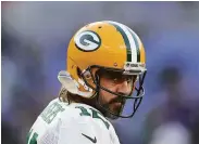  ?? Rob Carr / Getty Images ?? Aaron Rodgers says he’ll make a quick decision on his future once the Packers’ season ends.