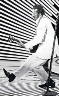  ??  ?? Chuck Berry performs his ‘duck walk’ on stage