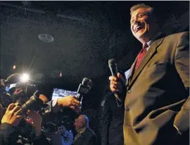  ?? Bob Chamberlin Los Angeles Times ?? CARMEN TRUTANICH jokes with the media on election night. The incumbent, who placed second in the contest to keep his post, got into the race late.