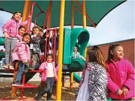  ??  ?? Preschool students at Turquoise Trail Charter Elementary spend time playing during an outdoor recess at the school last spring. A pediatrics associatio­n has issued a new statement urging a stronger focus on playtime.