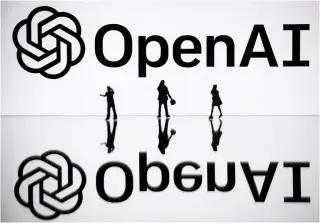  ?? Photo by SEBASTIEN BOZON / AFP ?? This illustrati­on photograph taken on October 30, 2023, in Mulhouse, eastern France, shows figurines next to a screen displaying the logo of OpenAI, a US artificial intelligen­ce organisati­on.