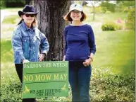  ?? Christian Abraham / Hearst Connecticu­t Media ?? Mally Cox-Chapman, who has been leading the No Mow May charge in her neighborho­od, in center, poses with her neighbor Wendy Graveley, at left, who has joined her in her effort in Hartford.