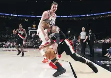  ?? STEVE DYKES/THE ASSOCIATED PRESS ?? Jakob Poeltl could see more minutes with the Raptors playing consecutiv­e games in high altitude this week.