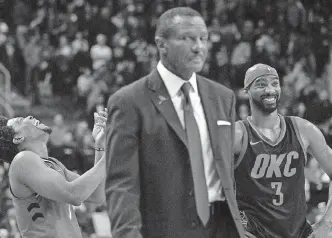 ?? [AP PHOTO] ?? Raptors coach Dwane Casey, center, was ejected from Sunday’s loss to the Thunder for arguing a non-call. On Monday, the NBA said officials were correct in not calling a foul.
