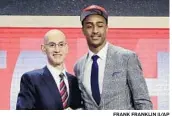  ?? FRANK FRANKLIN II/AP ?? John Collins poses with NBA Commission­er Adam Silver after being selected by Atlanta at No. 19 overall.