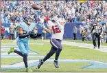  ?? James Kenney / Associated Press ?? Houston wide receiver Kenny Stills, right, catches a 12-yard pass for a touchdown as he is defended by Tennessee’s Logan Ryan during the Texans’ 24-21 win in Nashvile, Tenn. Sills caught three passes in the game, two of them for touchdowns.