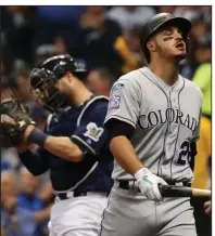  ?? AP/JEFF ROBERSON ?? Colorado third baseman Nolan Arenado reacts after striking out during the seventh inning of Thursday’s loss to Milwaukee. Arenado went 0 for 3 with 2 strikeouts.