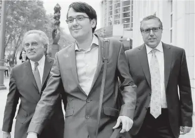  ??  ?? Former biotech CEO Martin Shkreli leaves federal court with his attorney Benjamin Brafman, left, and another lawyer in New York. Brafman told the jury during closing arguments that his client annoyed some of his investors, but ultimately rewarded them...