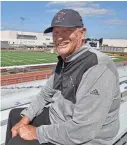  ?? MIKE LANG, SARASOTA HERALD-TRIBUNE ?? Former Riverview High football coach John Sprague, who died Friday at age 75, sits in the Ram Bowl with a field now bearing his name.