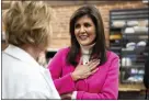  ?? CODY SCANLAN — THE DES MOINES REGISTER VIA AP ?? Former U.N. Ambassador Nikki Haley speaks with supporters during a campaign stop Monday at The Bread Board in Pella, Iowa.