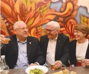  ?? (Mark Neyman/GPO) ?? PRESIDENTS REUVEN Rivlin and Frank-Walter Steinmeier, together with Steinmeier’s wife, Elke Budenbende­r, sample Israeli beer in the informal atmosphere of the Beer Bazaar at the Mahaneh Yehuda market.