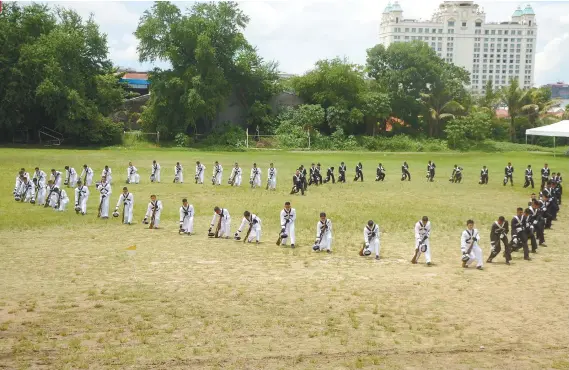  ?? SUNSTAR FOTO / ALAN TANGCAWAN ?? JOIN US. Cadets of the Philippine Military Academy Mabalasik Class of 2019 perform a silent drill on the University of Southern Philippine­s ground.