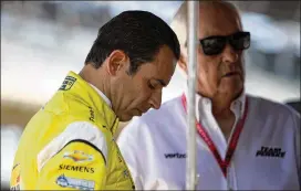  ?? CHRIS GRAYTHEN / GETTY IMAGES ?? Helio Castroneve­s, driver of the No. 3 Pennzoil Chevrolet, talks with team owner Roger Penske at the Indianapol­is Motor Speedway on Friday.