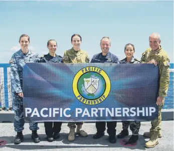  ?? ?? The UK-Aussie team on Mercy with Lt Hailey and Capt Maynard, second and fourth left.