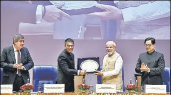  ?? HT PHOTO ?? Prime Minister Narendra Modi with CJI Dhananjaya Y Chandrachu­d, law minister Kiren Rijiju and justice Sanjay Kishan Kaul on Saturday.