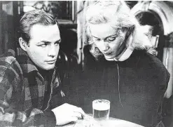  ?? Columbia Pictures ?? “On the Waterfront,” with Oscar winners Marlon Brando and Eva Marie Saint, was a contender at the Academy Awards. Nomimated in 12 categories, the 1954 film won eight. It airs tonight on TCM.