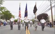  ?? Jarret Liotta / For Hearst Connecticu­t Media ?? The Color Guard marches along the Post Road at the Memorial Day celebratio­n in 2018, in Darien. After last year’s parade was canceled due to COVID-19, for the first time in decades, the Monuments & Ceremonies Commission says it is back on this year, contingent on cases staying low.