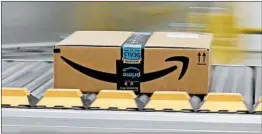  ?? RICH PEDRONCELL­I/AP ?? Federal regulators have said Amazon’s contract with the Postal Service is profitable.