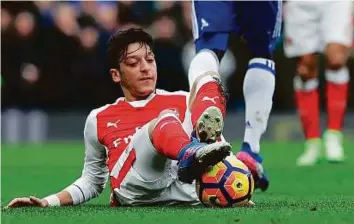  ?? AP ?? Mesut Ozil’s dismal show during Arsenal’s defeat against Chelsea is one of many he has been poor recently. The out of form playmaker could be dropped for Bayern Munich tomorrow.