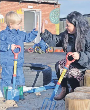  ?? ?? High five Sandy fun at the play facility at Townhead Primary nursery