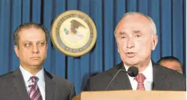  ?? MARK LENNIHAN/ASSOCIATED PRESS ?? U.S. Attorney Preet Bharara, left, listens as New York City Police Commission­er William Bratton discusses the arrest of four people in connection with New York City’s ongoing corruption probe during a June 20 news conference.