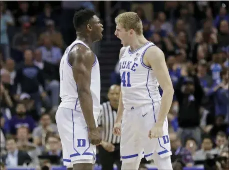  ?? NELL REDMOND — THE ASSOCIATED PRESS ?? Duke’s Zion Williamson, left, celebrates with Jack White, right, after a play against Florida State during Saturday’s ACC championsh­ip game.