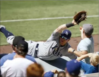  ?? ALEX GALLARDO — THE ASSOCIATED PRESS ?? Tampa Bay first baseman Logan Morrison catches a foul fly ball hit by the Dodgers’ Howie Kendrick during the seventh inning in Los Angeles on Wednesday. The Rays won, 3-1.