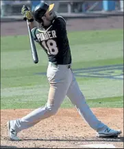  ?? Harry How / Getty Images ?? The Athletics’ Chad Pinder hits a three-run home run against the Astros during the seventh inning of Game 3 of the American League Division Series at Dodger Stadium on Wednesday in Los Angeles.