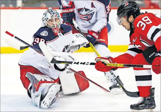  ?? [KATHY WILLENS/THE ASSOCIATED PRESS] ?? Devils right wing Nick Merkley watches as his shot goes past Blue Jackets goaltender Elvis Merzlikins for a goal that tied it 2-2 during the second period.