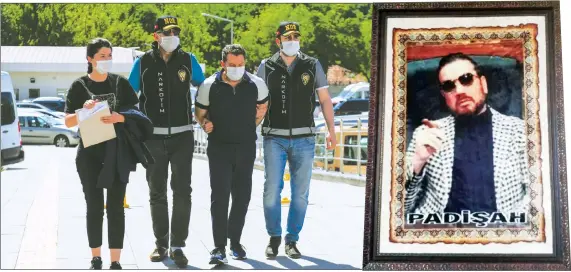  ??  ?? Police officers escort Nejat Daş, one of the suspects, to the police headquarte­rs, in Ankara, Turkey on Tuesday. Right, a portrait of one of the suspects – Çetin Gören, according to the media — found in his office. The caption reads sultan in Turkish.