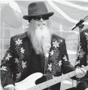  ?? KIICHIRO SATO/AP 2010 ?? Dusty Hill died at his home in Houston. Above, Hill is shown performing at a festival in Chicago.
