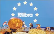  ?? — Reuters ?? Small toy figures are seen on representa­tions of the virtual currency before the displayed EU flag and the Facebook Libra logo in this illustrati­on picture.