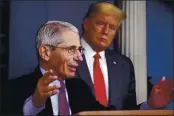  ?? ALEX BRANDON — THE ASSOCIATED PRESS ?? On April 22, President Donald Trump watches as Dr. Anthony Fauci, director of the National Institute of Allergy and Infectious Diseases, speaks in the James Brady Press Briefing Room of the White House in Washington.