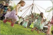  ?? CONTRIBUTE­D PHOTO ?? “Fairies” dance around a May pole during a previous festival at the Bellamy-Ferriday House & Garden in Bethlehem. This year’s Fairy Festival is set for Saturday.