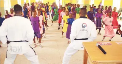  ?? Photo: NAN ?? Students of Junior Secondary School Jabi in Abuja, receive self defence classes in Taekwondo organised by Mary Star Seed Developmen­t Global Foundation, during the visit of the foundation to the school’s premises in Abuja yesterday