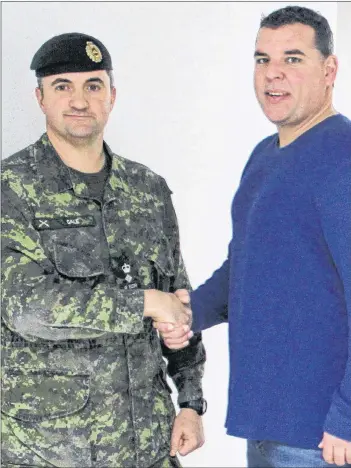  ?? COLIN MACLEAN/JOURNAL PIONEER ?? Adam Binkley, eight, executive director of the Summerside Boys and Girls Club, thanks Lt.-Col. Jason Gale for the work done at the club through Exercise NIHILO SAPPER 2018.