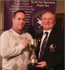  ??  ?? Winner of the Tommy Dwyer Cup at Laytown &amp; Bettystown Golf Club, Stephen Branigan, is presented with his trophy by Club Captain Bryan Collins.